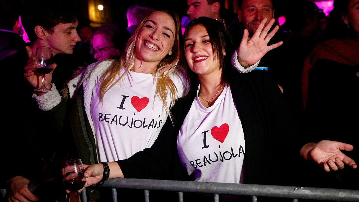Party goers celebrate the drilling of this year's Beaujolais barrels