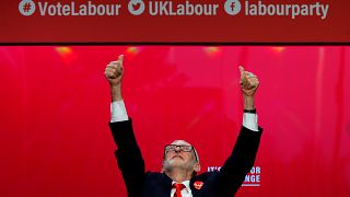 Jeremy Corbyn waves to cheering students at the Labour manifesto launch