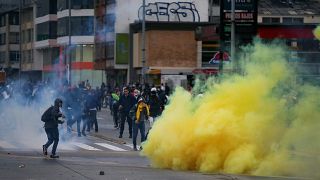 Demonstrators clash with riot police during a protest in Bogota, Colombia, November 21, 2019.