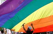 Participants march under a giant rainbow flag during the LGBT Pride parade in Taipei, Taiwan