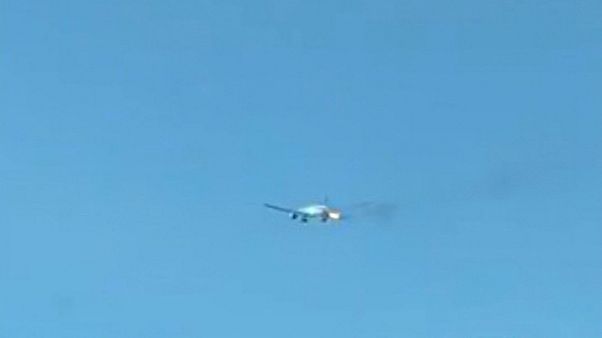 Plane makes emergency landing after flames burst from engine Plane makes emergency landing after flames burst from engine