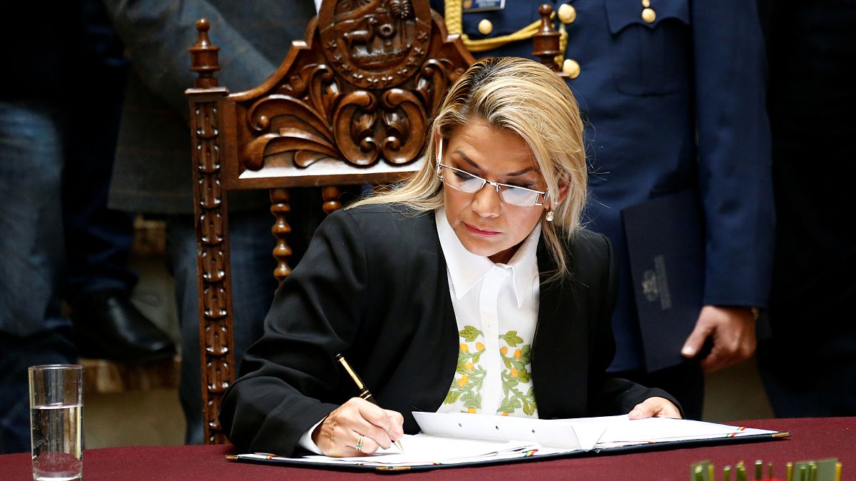 Bolivia's interim President Jeanine Anez enacts the law for general election at the national congress in La Paz, Bolivia, November 24, 2019.