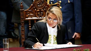 Bolivia's interim President Jeanine Anez enacts the law for general election at the national congress in La Paz, Bolivia, November 24, 2019.