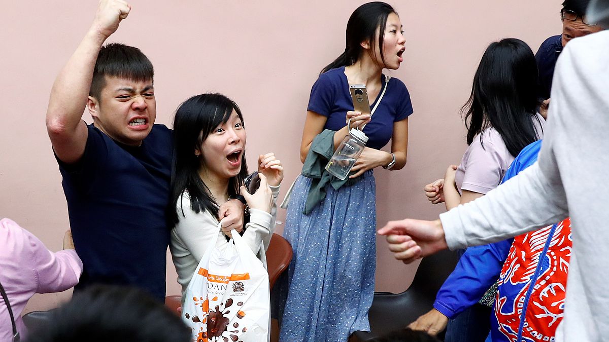 Celebrations as pro-democracy candidates sweep the board in Hong Kong local elections