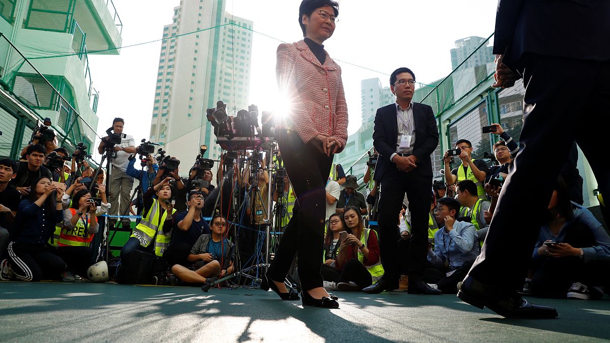 Hong Kong Chief Executive Carrie Lam leaves after speaking to the media, after casting her vote at a polling station during district council local elections in Hong Kong