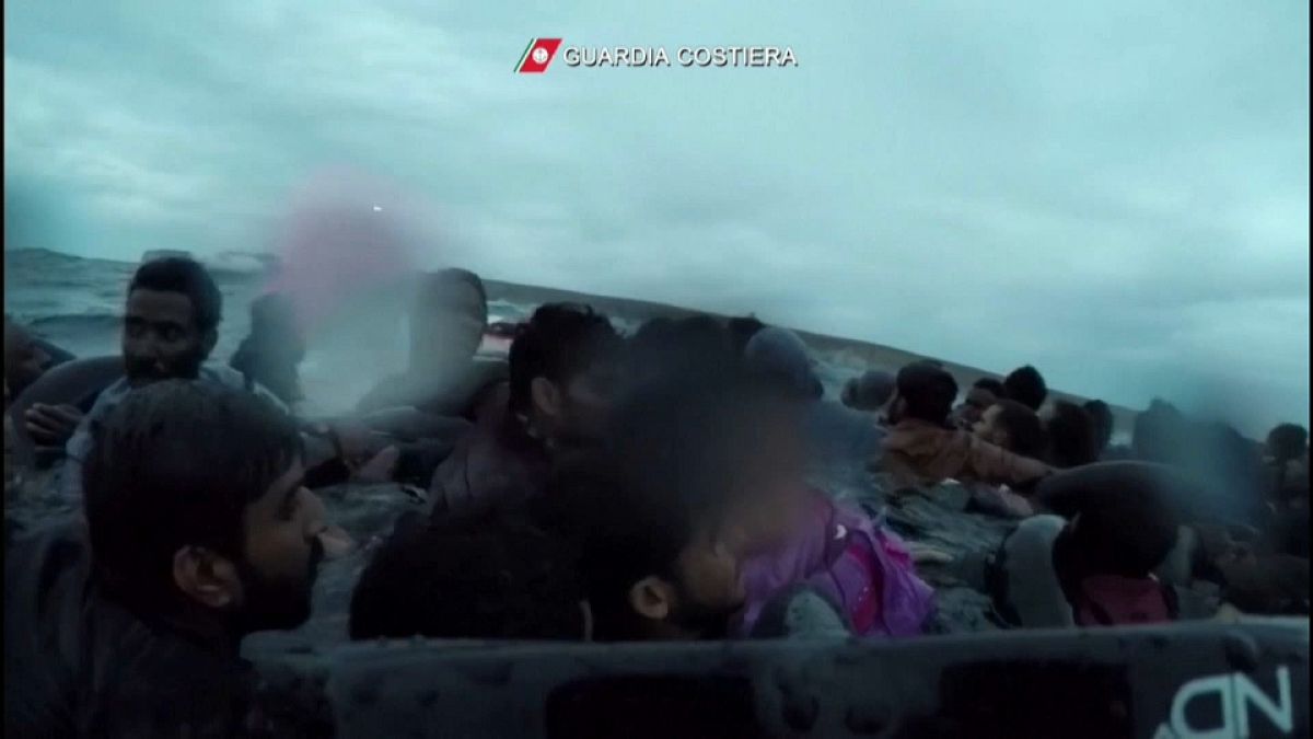 A child is rescued after a ship carrying migrants capsized off the coast of Lampedusa
