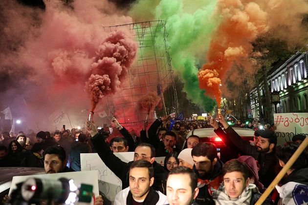 Opposition supporters take part in a rally to protest against the government and demand an early parliamentary election in Tbilisi, Georgia November 25, 2019.
