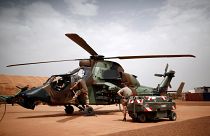 French soldiers work on a Tiger attack helicopter at the Operational Desert Plateform Camp (PfOD) during the Operation Barkhane in Gao, Mali, August 1, 2019. 