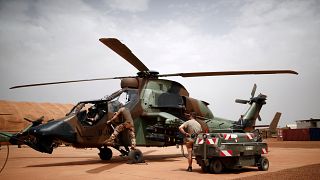 French soldiers work on a Tiger attack helicopter at the Operational Desert Plateform Camp (PfOD) during the Operation Barkhane in Gao, Mali, August 1, 2019. 