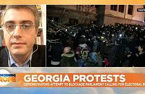 Georgian riot police deploy water cannon as protesters in Tbilisi try to blockade parliament
