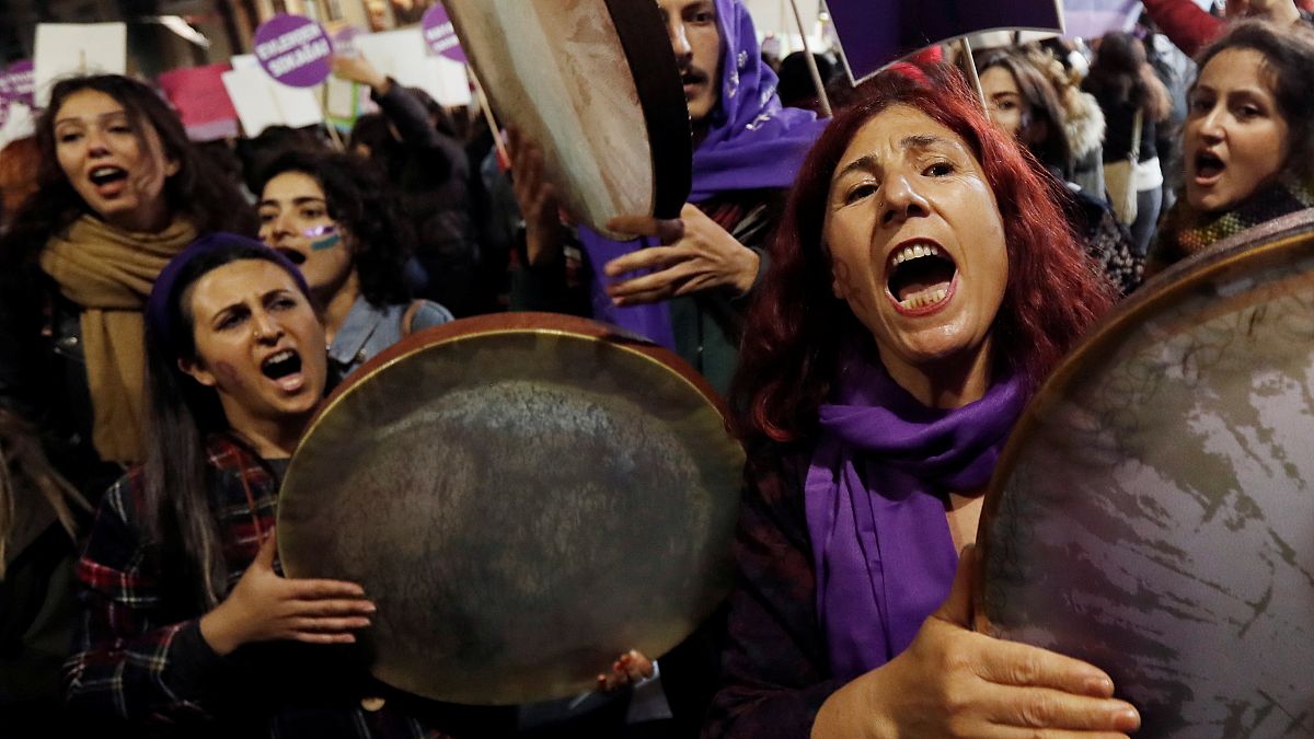 Demonstrators shout slogans during a protest against femicide and violence against women, in Istanbul