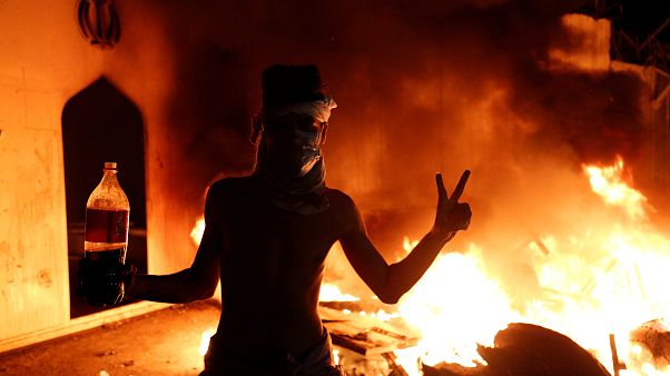An Iraqi demonstrator in front of the Iranian consulate in Najaf An Iraqi demonstrator in front of the Iranian consulate in Najaf