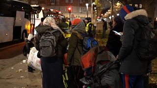 Refugees were lining at dawn to embark into buses as their campsite in northern Paris was being evacuated on Thursday, November 28th