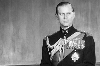 In this June 10, 1956 file photo, the Duke of Edinburgh poses for a photo as he observes his 35th birthday anniversary in Buckingham Palace, London