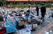 Police officers gather forensic evidence at the campus of the Polytechnic University (PolyU) in Hong Kong
