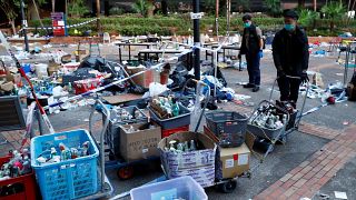 Police officers gather forensic evidence at the campus of the Polytechnic University (PolyU) in Hong Kong