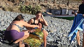 Members of the public came to the aid of the exhausted migrants on a Canary Islands beach