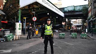 Police officers guard outside Borough Market after an incident at London Bridge