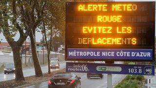 A road sign reads "Red alert, avoid your trips" as the french Riviera is under a red alert for heavy rain and floods, in Nice, France, December 1, 2019.