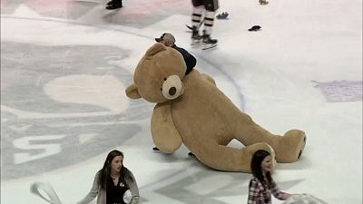 Hockey game becomes bear pit as 45,000 teddy bears hit the ice in new world record