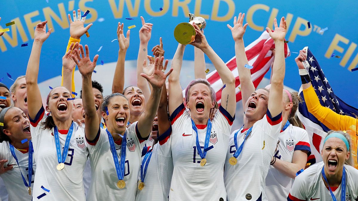 The US women's team, led by Rapinoe, celebrates winning the 2019 World Cup