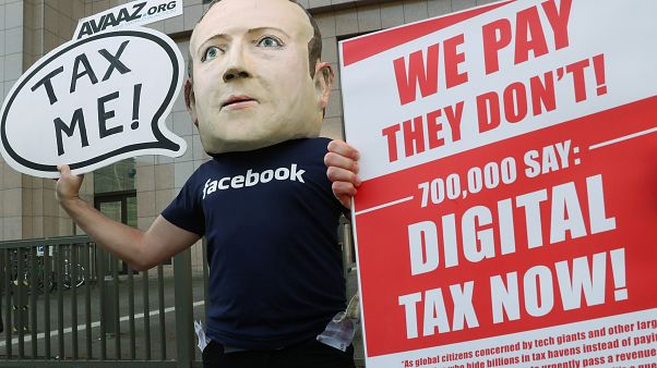 FILE PHOTO An activist wearing a mask depicting Facebook's CEO Mark Zuckerberg demonstrates during the European Union finance ministers meeting in Brussels, 2018 FILE PHOTO An activist wearing a mask depicting Facebook's CEO Mark Zuckerberg demonstrates during the European Union finance ministers meeting in Brussels, 2018