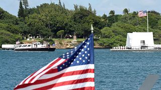 US President Barack Obama and Japanese Prime Minister Shinzo Abe arrive at the USS Arizona Memorial at Joint Base Pearl Harbor-Hickam in Honolulu, Hawaii, December 27, 2016.