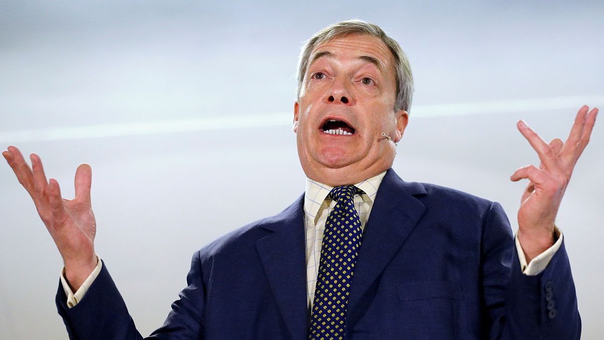 FILE PHOTO: Brexit Party leader Nigel Farage gestures as he speaks during a visit to Buckley, Britain December 2, 2019. 