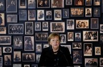 Merkel visits Auschwitz memorial for the first time after 14 years as Germany's Chancellor