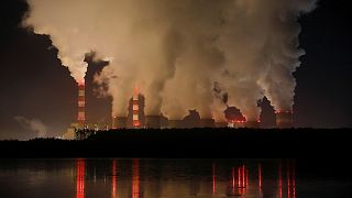 Smoke and steam billows from Belchatow Power Station, Europe's largest coal-fired power plant operated by PGE Group, at night near Belchatow, Poland December 5, 2018.
