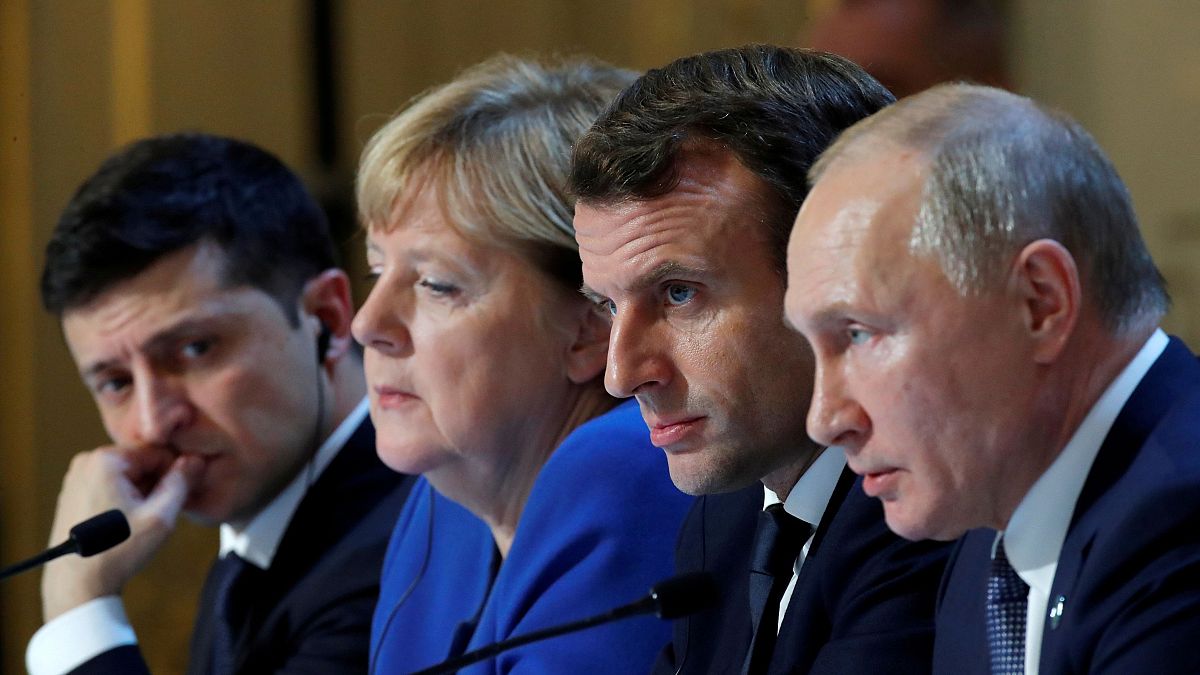 Ukraine's Volodymyr Zelenskiy (L), Germany's Angela Merkel, France's Emmanuel Macron, and Russia's Vladimir Putin in Paris on December 9, 2019.