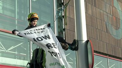 Eight-year-old scales street light to demand climate action at Madrid talks