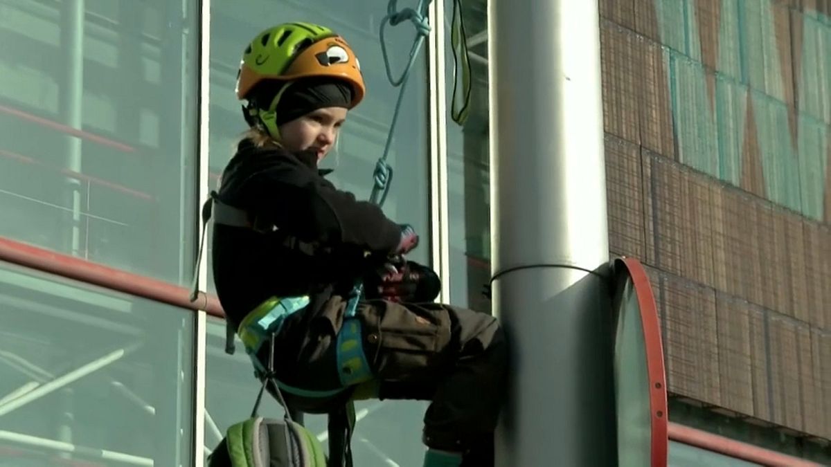 Eight-year-old climate activist climbs lamp post to protest outside COP25