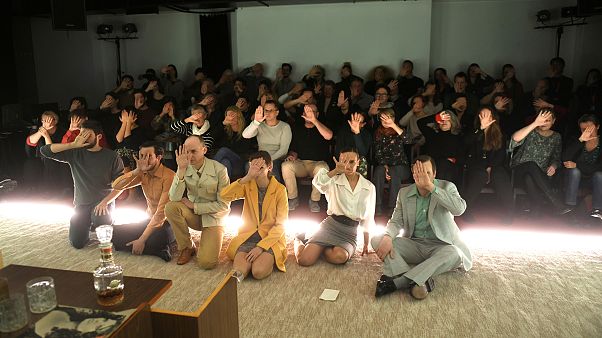 Actors and the audience hold up their hands at Budapest's Trafo threatre in protest against a plan by Hungary's government- Budapest December 8, 2019. Actors and the audience hold up their hands at Budapest's Trafo threatre in protest against a plan by Hungary's government- Budapest December 8, 2019.