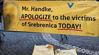 A banner protesting against 2019 Nobel literature prize laureate Peter Handke is seen at the Stockholm Concert Hall, in Stockholm, Sweden, December 10, 2019.