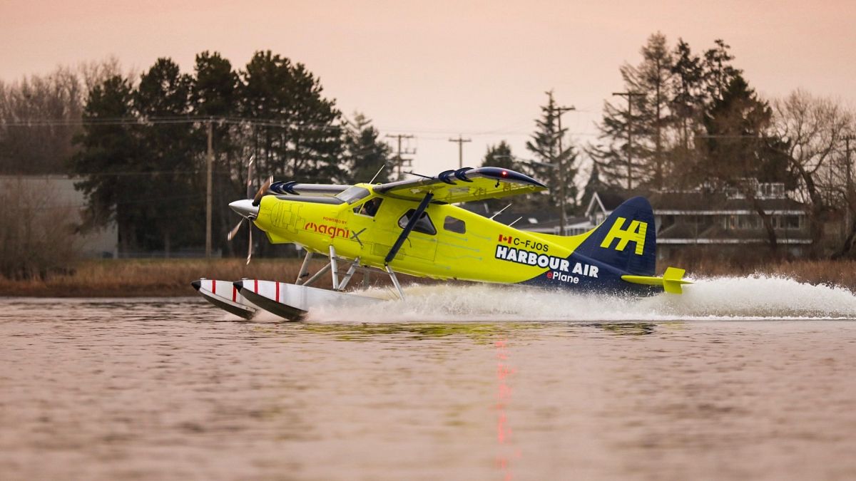 A Habour Air seaplane powered by an magniX all-electric propulsion system lands after a test flight on December 10, 2019.