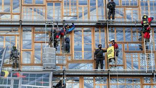 Police remove climate change activists from the EU Council headquarters, during a Greenpeace protest, ahead of an EU leaders summit in Brussels, Belgium December 12, 2019.