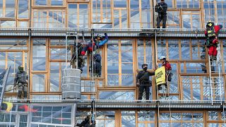 Police remove climate change activists from the EU Council headquarters, during a Greenpeace protest, ahead of an EU leaders summit in Brussels, Belgium December 12, 2019. 