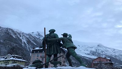  Chamonix, 12 December 2019 - Statue of Jaques Balmat showing Horace Benedict de Sassure the route up to the summit of Mont Blanc.