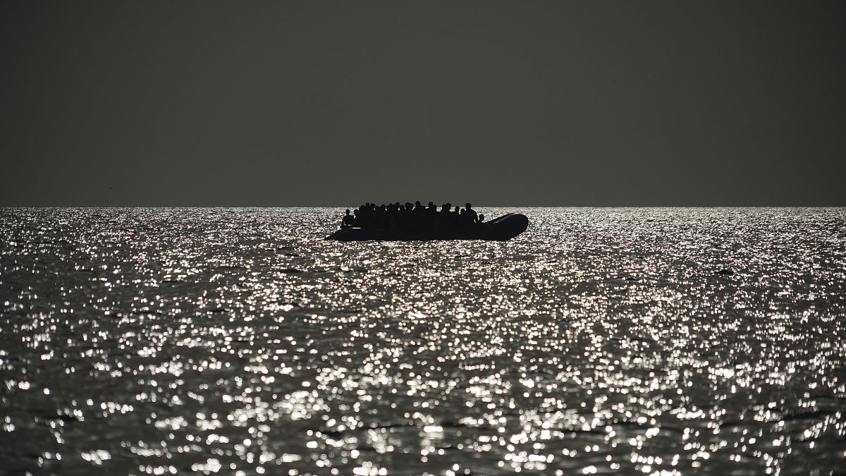 An overcrowded rubber boat is seen on the horizon in the Mediterranean Sea, 18 September, 2019. The Ocean Viking regularly conducts rescue missions on the Mediterranean,