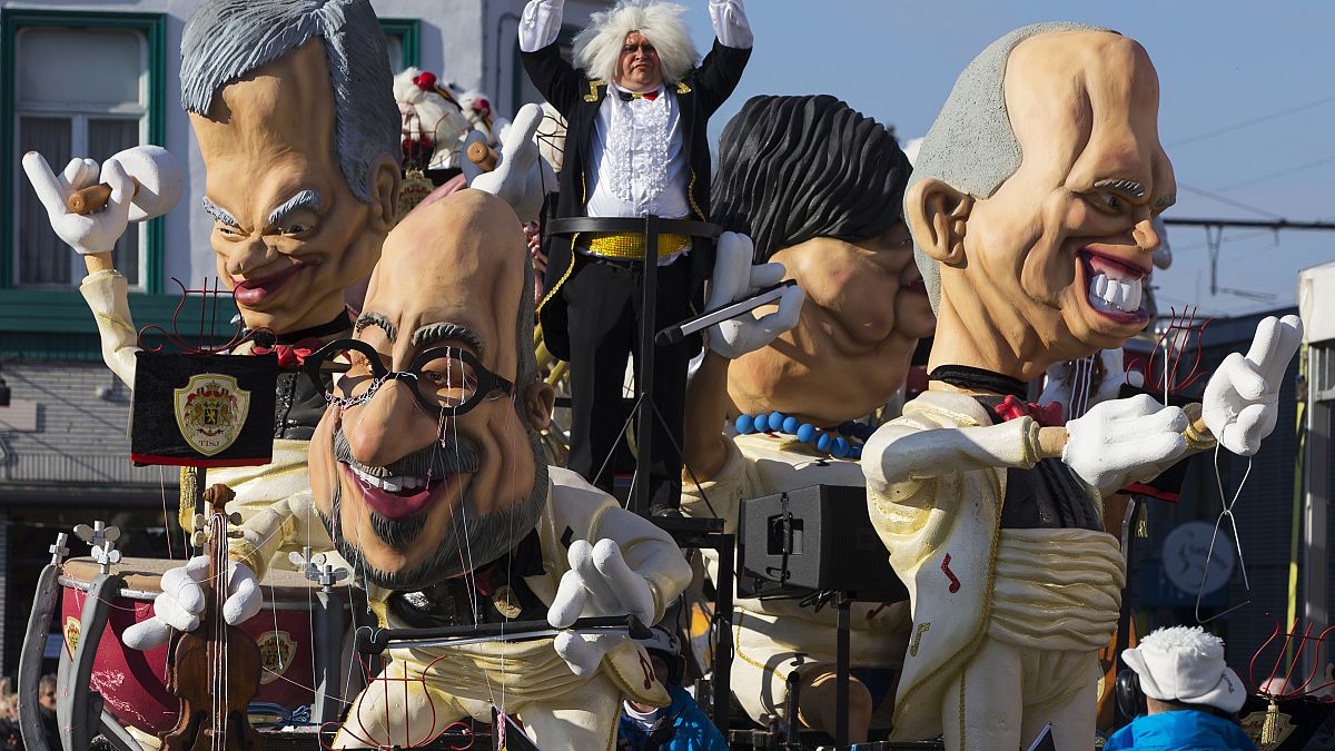 Giant figures depicting Belgian Prime Minister Charles Michel (C) and other politicians are seen during the 87th carnival parade of Aalst February 15, 2015.