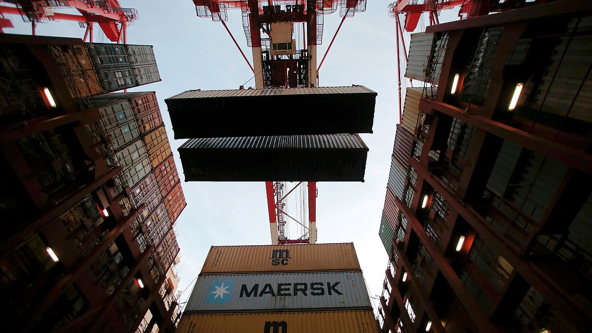 FILE PHOTO: Containers are seen unloadedat the Yangshan Deep Water Port, part of the Shanghai Free Trade Zone, in Shanghai, China, September 24, 2016. 