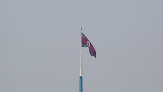 A North Korean flag flutters on top of a tower at North Korea's propaganda village of Gijungdong, as seen from Paju, South Korea, September 30, 2019.
