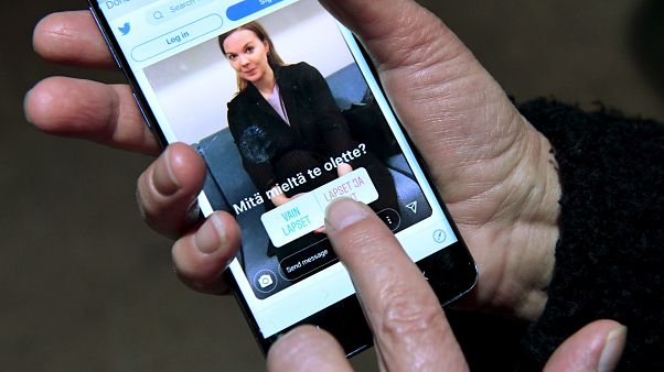 An Instagram post depicting Finnish Finance Minister Katri Kulmuni is seen on a phone running the Twitter app in Helsinki, Finland December 13, 2019. An Instagram post depicting Finnish Finance Minister Katri Kulmuni is seen on a phone running the Twitter app in Helsinki, Finland December 13, 2019.