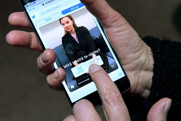 An Instagram post depicting Finnish Finance Minister Katri Kulmuni is seen on a phone running the Twitter app in Helsinki, Finland December 13, 2019. 