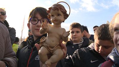 Pope Francis blesses baby Jesus statues during Angelus