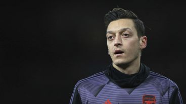 Arsenal footballer Mesut Ozil 'misled' over Uighurs, says China