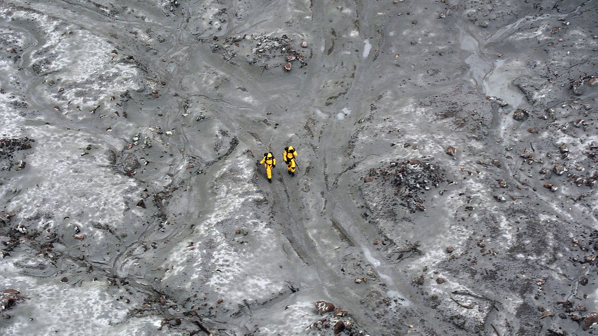 Rescuers on White Island off the coast of New Zealand's North Island