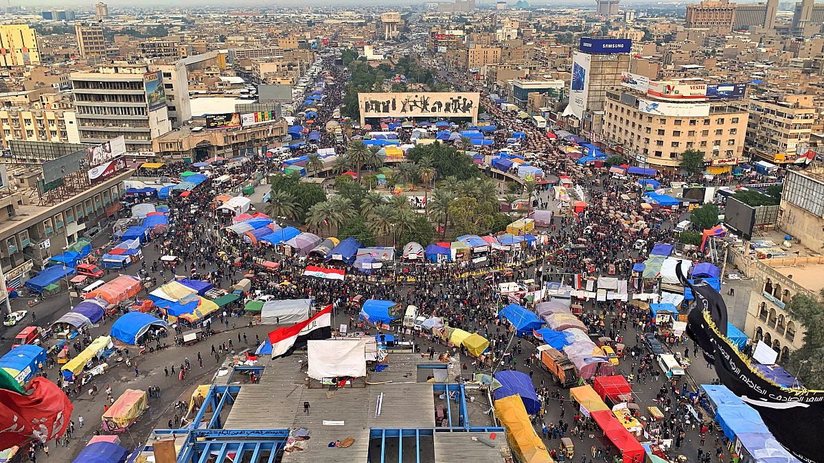 Anti-government protesters gather in Tahrir Square during ongoing protests in Baghdad, Iraq, Tuesday, Dec. 10, 2019. (AP Photo/Ali Abdul Hassan)