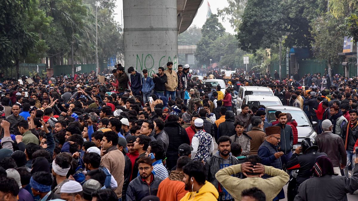 Protesters outside Jamia Millia Islamia university in Delhi